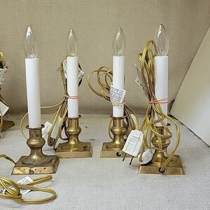 LOT OF 4 ELECTIC BRASS BASE 7” CANDELSTICKS WITH SWITCH AND BULBS. Set 1